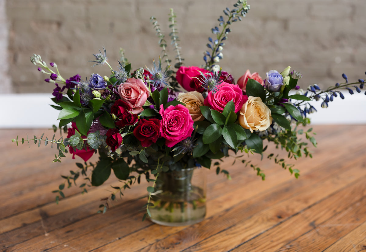 Colorful custom wedding floral arrangement by 21 Petals