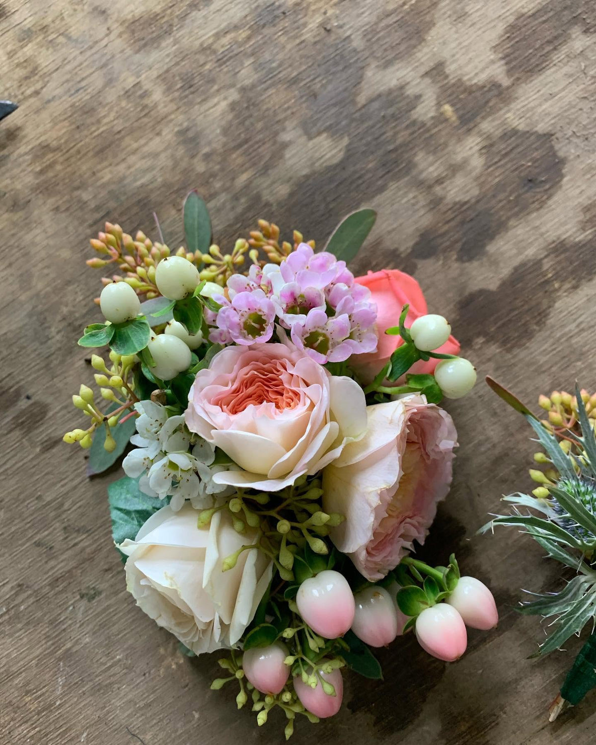 Peach and cream rose prom corsage designed by 21 Petals